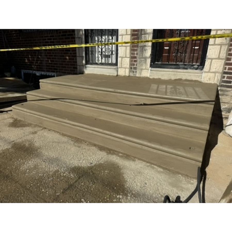 Wide new concrete front steps at a brick home in Philadelphia